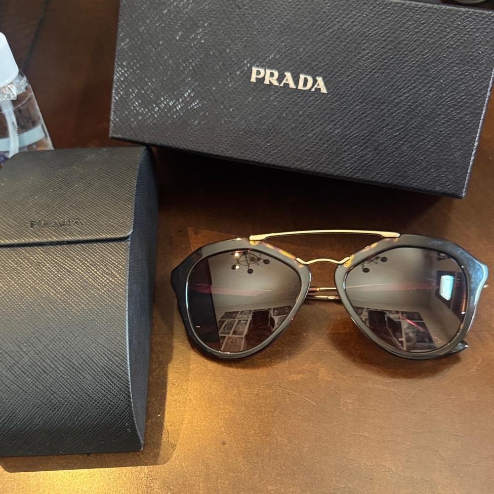 Prada Elegant Black and Gold Eyewear
